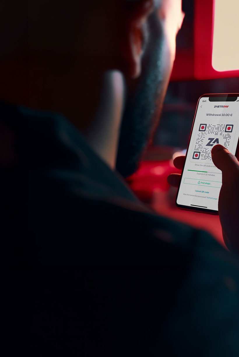 Man looking at smartphone with Zastrpay app